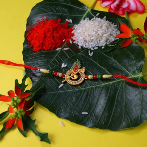 Krishna Flute Rakhi with Stone Studded Peacock Feather...