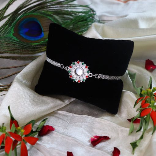 Elegant Silver-Plated Floral Rakhi with Red and Green...