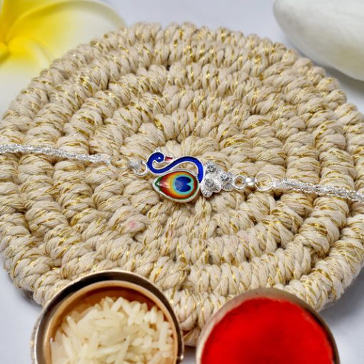 Elegant Silver Peacock Rakhi with Tricolor Enamel –...
