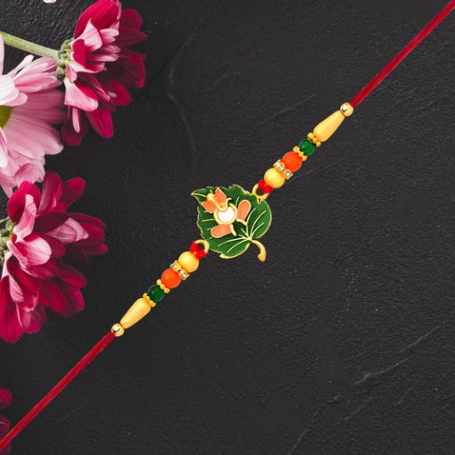 Green Tulsi Leaf Rakhi with Orange Enamel Flower...
